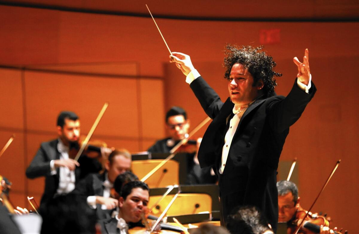 Gustavo Dudamel conducts at Walt Disney Concert Hall, among the entertainment venues downtown. Nearby Dorothy Chandler Pavilion and Ahmanson Theatre are longtime residents.