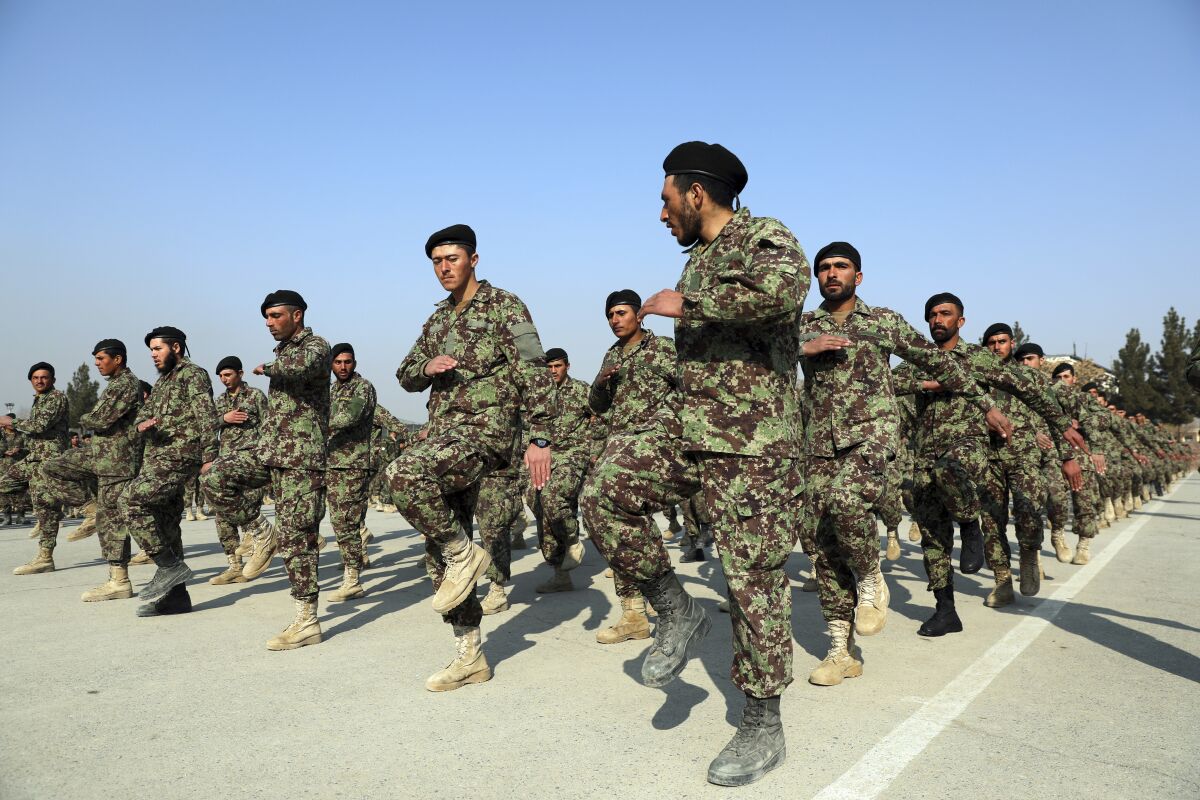 New Afghan army troops march during their graduation ceremony at the Afghan Military Academy in Kabul. 