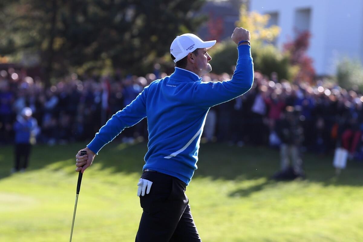 Europe's Justin Rose celebrates putting on the 11th green during the foursomes match on the first day of the 40th Ryder Cup at Gleneagles in Scotland.
