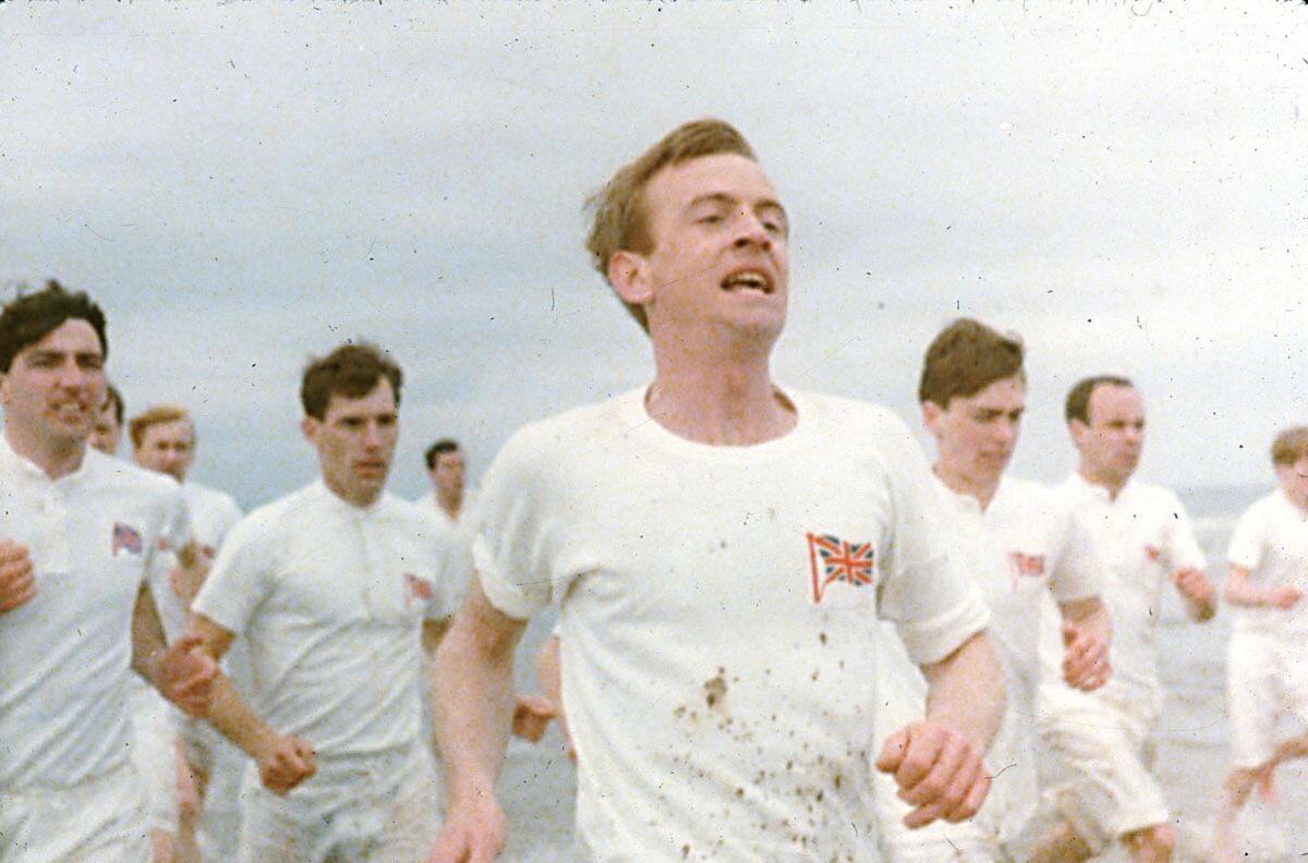 A group of men running on the beach in a scene from “Chariots of Fire.”