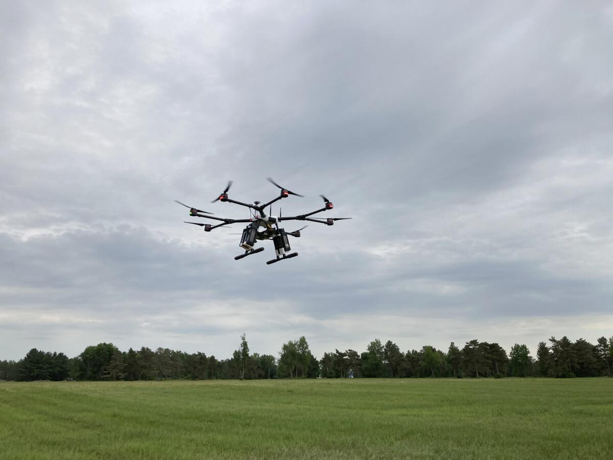 A drone flies at one of the Federal Aviation Administration’s designated drone testing sites run by nonprofit Northeast UAS Airspace Integration Research Alliance Inc., at Griffiss International Airport in Rome, N.Y., on June 11, 2021. The FAA is working to relax some aviation rules to allow some drone operators to fly their machines out of their line of sight. (AP Photo/Matt O’Brien)