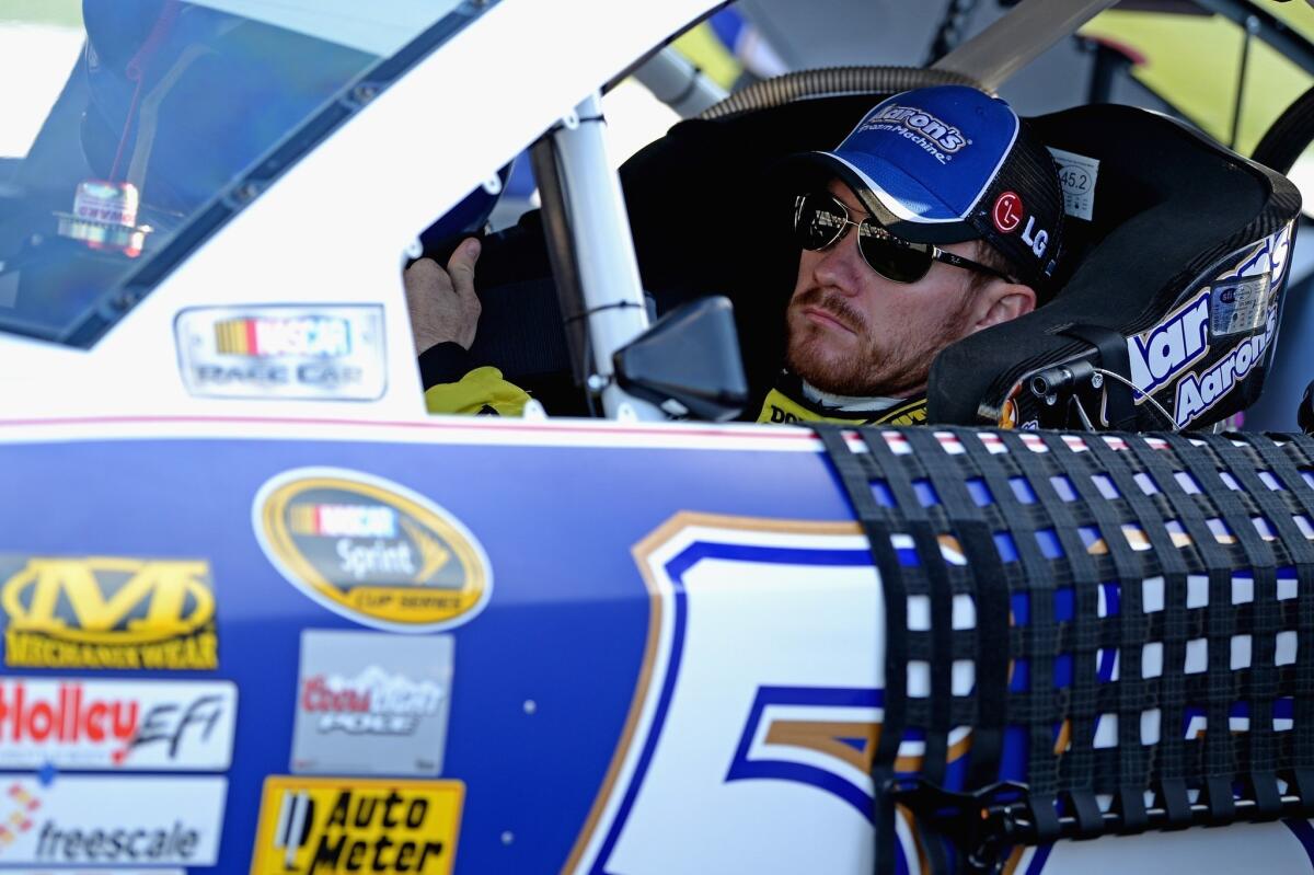 Brian Vickers sits in his car during qualifying for the NASCAR Sprint Cup Series Federated Auto Parts 400 at Richmond (Va.) International Raceway.