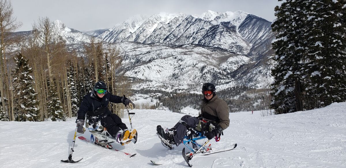 Al Kovach, left, with another ski scholarship recipient and paralyzed veteran in Durango, Colorado.