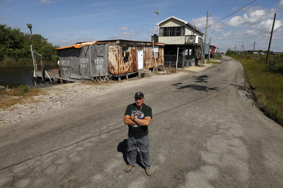 Chief Albert Naquin stands at the end of Island Road on the Isle of Jean Charles where his family once lived. (Carolyn Cole / Los Angeles Times)