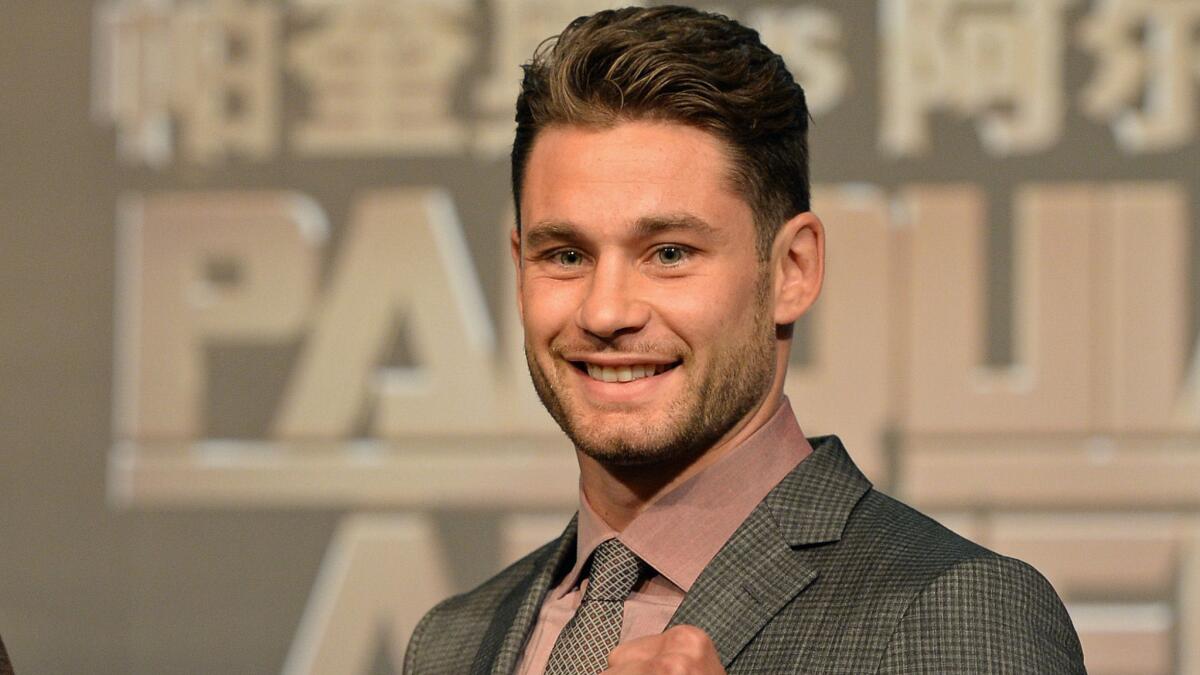 Chris Algieri poses for photographs during an Aug. 25 news conference in Macau to promote his scheduled fight against Manny Pacquiao. Algieri is confident he can pull off a major upset victory over Pacquiao.