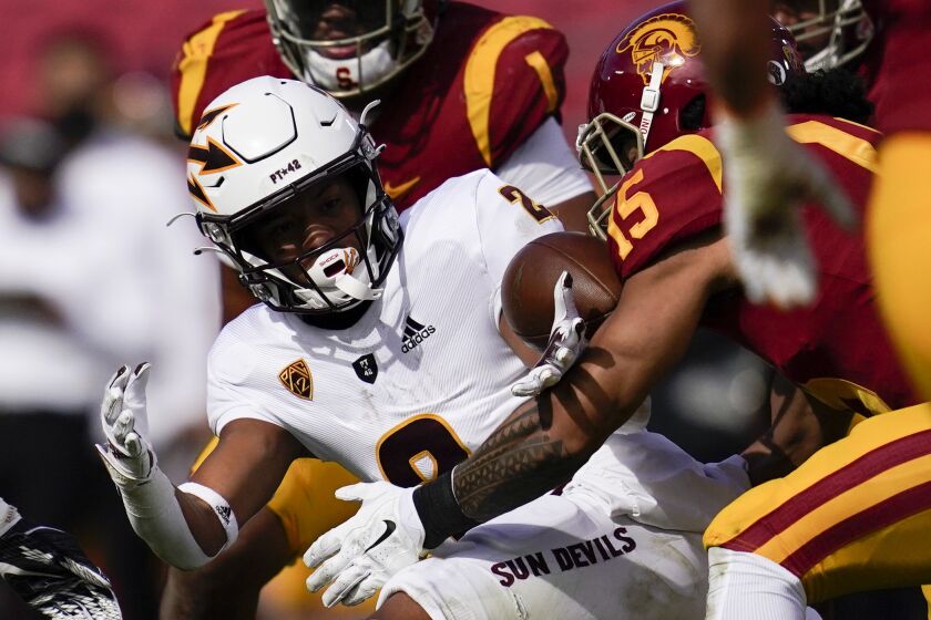 The ball comes loose for a fumble as Arizona State wide receiver LV Bunkley-Shelton (2) is tackled by Southern California safety Talanoa Hufanga (15) during the first half of an NCAA college football game Saturday, Nov. 7, 2020, in Los Angeles. (AP Photo/Ashley Landis)