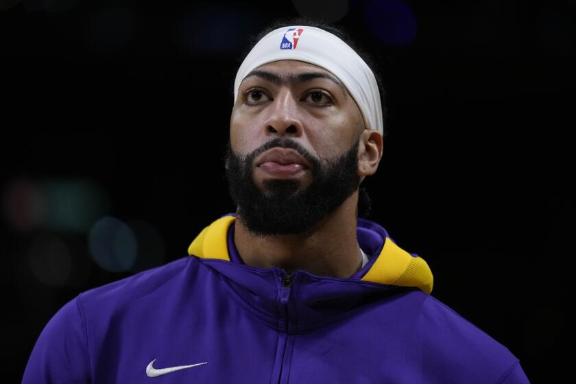 Los Angeles Lakers' Anthony Davis stands on the court during warmups.