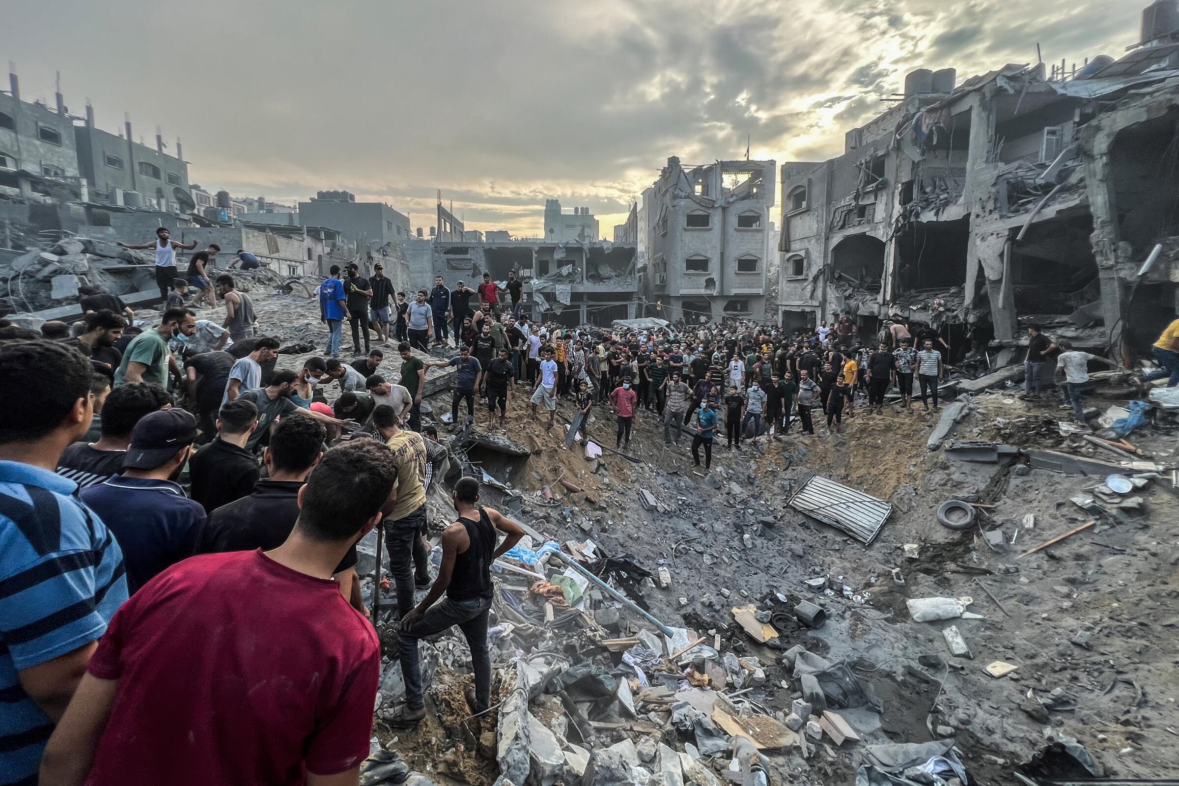 Palestinians search for survivors following an Israeli airstrike in the Jabalia refugee camp north of Gaza City.