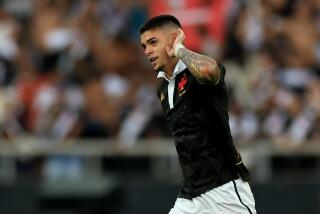 Gabriel Pec holds his hand to his ear and celebrates after scoring the third goal of Vasco's match against Fluminense 