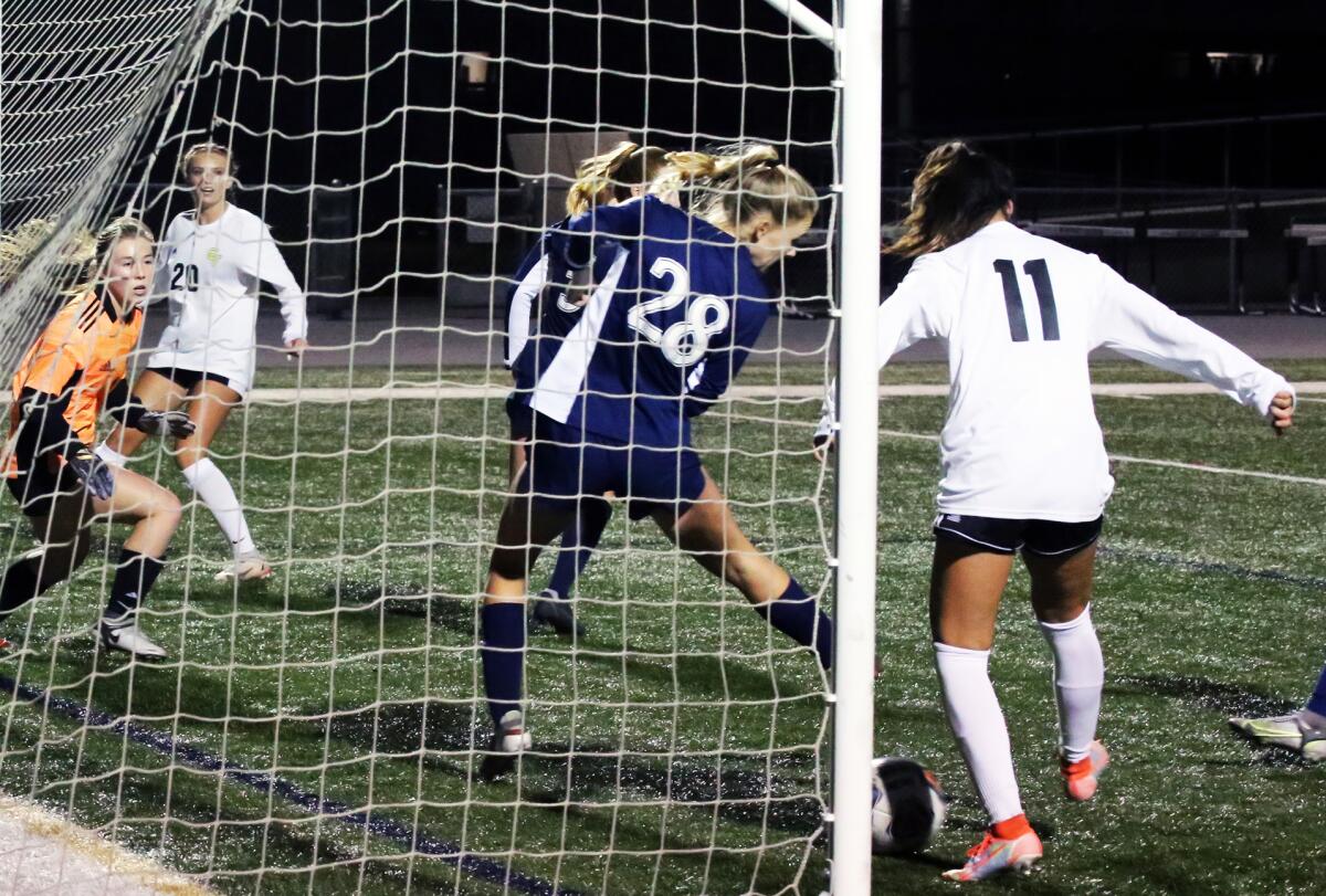 Capistrano Valley's Kate Armbrust (11) scores against Newport Harbor in the second half on Wednesday.