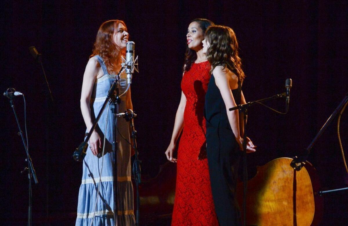 Singers Gillian Welsh, left, Rhiannon Giddens and actress Carey Mulligan perform together during "Another Day, Another Time: Celebrating the Music of Inside Llewyn Davis" at The Town Hall on Sunday in New York.