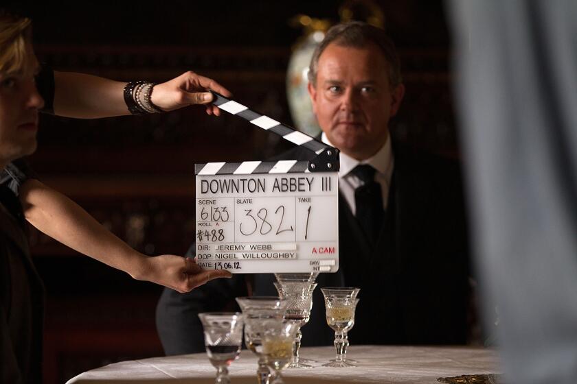 Hugh Bonneville, who plays the Earl of Grantham, awaits the call of "Action" during the filming of Season 3 of the hit period drama "Downton Abbey."