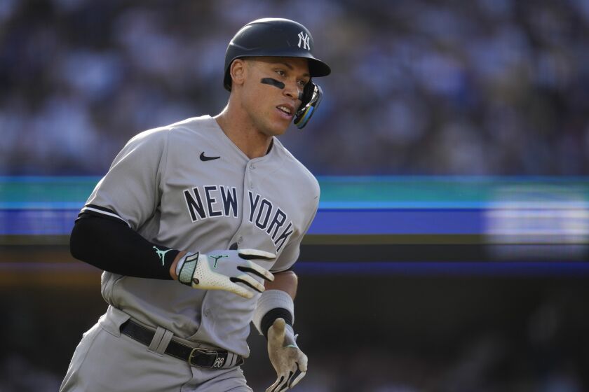 New York Yankees' Aaron Judge (99) runs the bases after hitting a home run during the sixth inning of a baseball game against the Los Angeles Dodgers in Los Angeles, Saturday, June 3, 2023. (AP Photo/Ashley Landis)