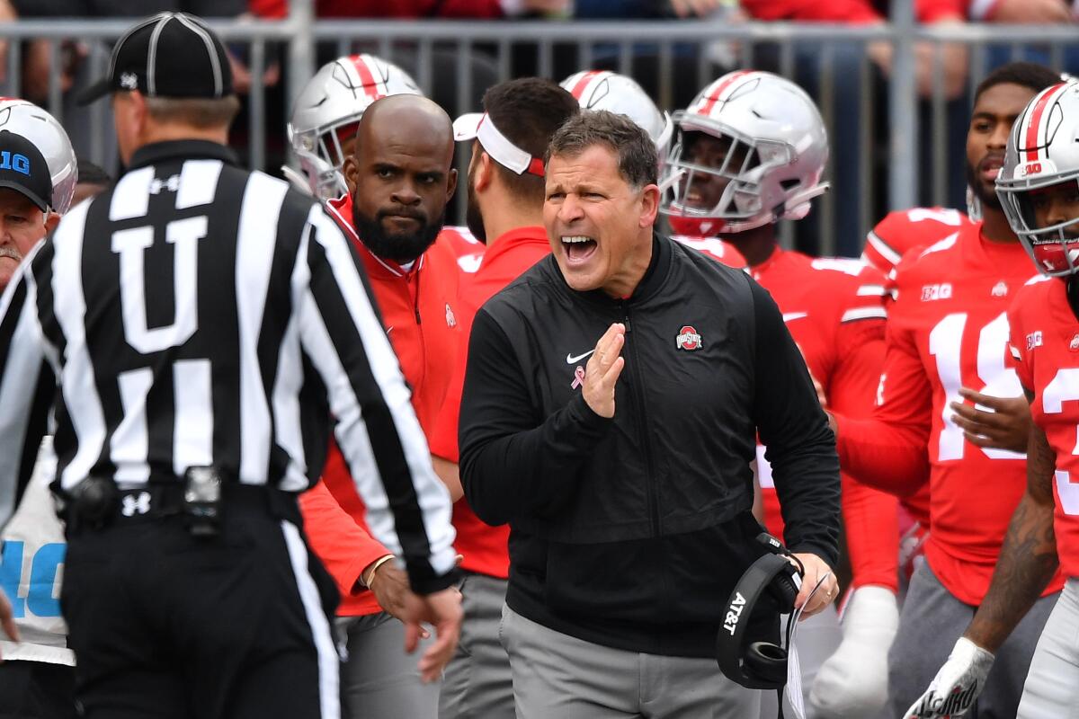 Ohio State defensive Coordinator Greg Schiano talks with an official during the second quarter of a game Oct. 13, 2018 against Minnesota at Ohio Stadium.