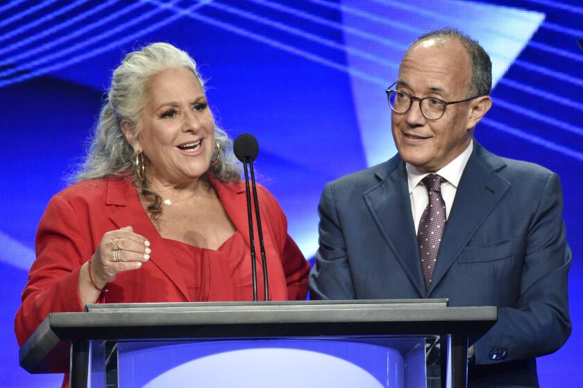 Marta Kauffman, left, and David Crane, co-creators of the television series "Friends," accept the Heritage Award at the 34th annual TCA Awards during the 2018 Television Critics Association Summer Press Tour, Saturday, Aug. 4, 2018, in Beverly Hills, Calif. (Photo by Chris Pizzello/Invision/AP)