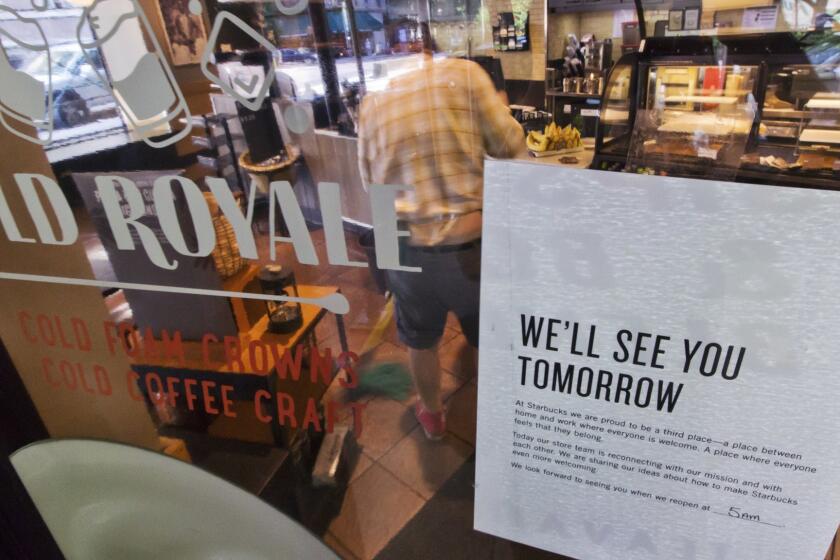 A sign advising that a Starbucks is closed, is posted in the window of a store on New York's West Side as a barista mops the floor, Tuesday, May 29, 2018. Starbucks will close more than 8,000 stores nationwide Tuesday to conduct anti-bias training, the next of many steps the company is taking to try to restore its tarnished image as a hangout where all are welcome. (AP Photo/Richard Drew)