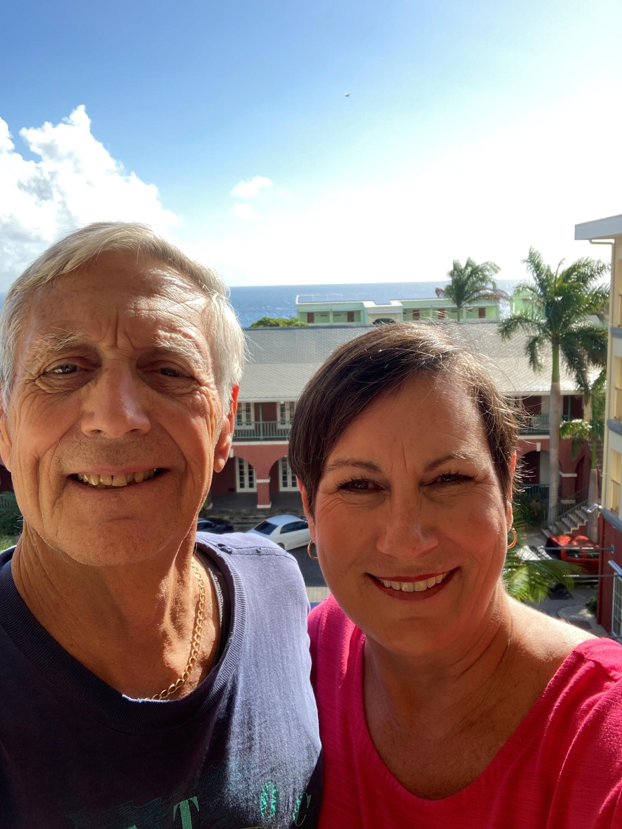 Christina and Paul D'Amore on the balcony of their Barbados hotel where they isolated for seven days.