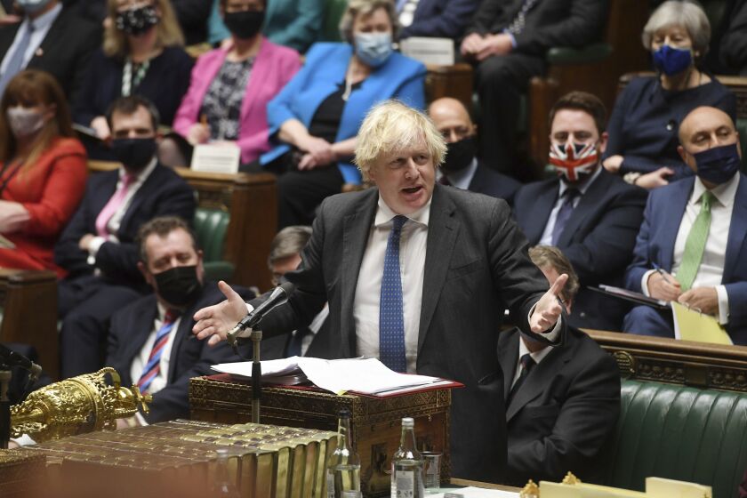 In this photo issued by UK Parliament, Britain's Prime Minister Boris Johnson speaks during Prime Minister's Questions in the House of Commons, London, Wednesday Dec. 15, 2021. (Jessica Taylor/UK Parliament via AP)