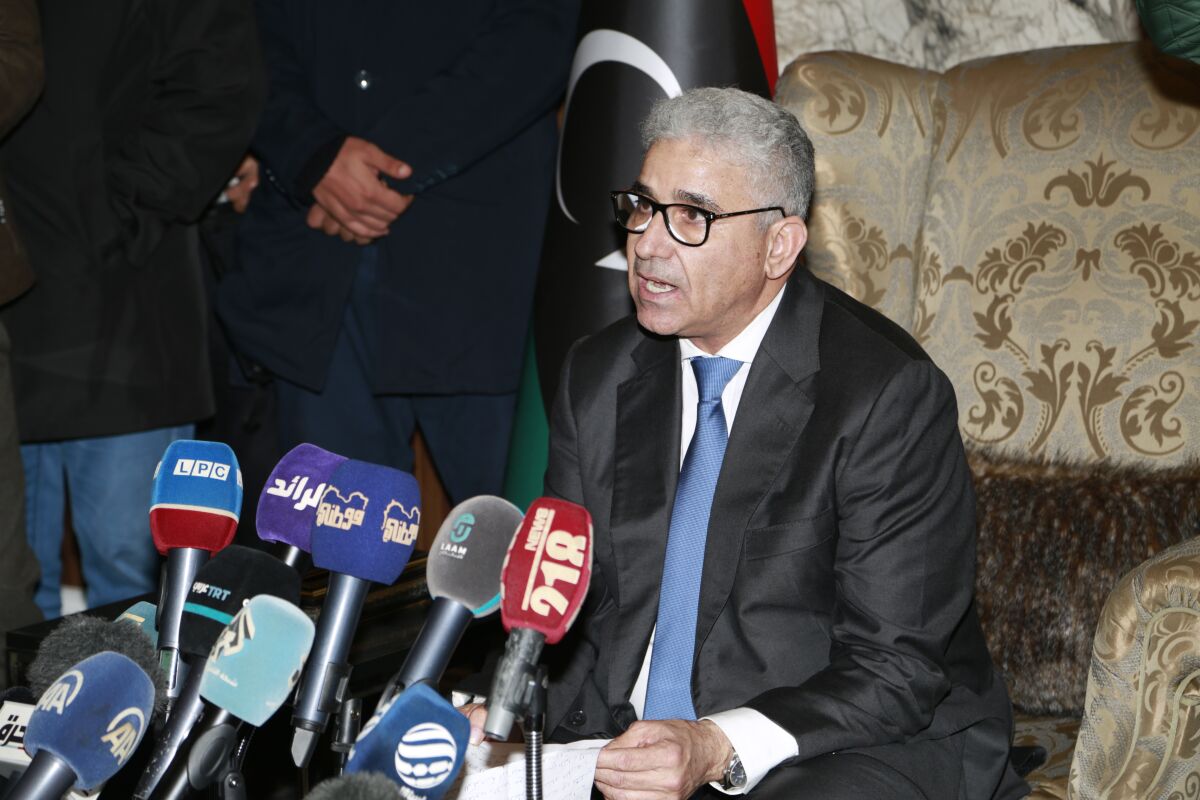 FILE - Fathi Bashagha holds a news conference after east-based lawmakers named Bashagha to replace then Prime Minister Abdul Hamid Dbeibah as head of a new interim government, in Tripoli, Libya, Feb. 10, 2022. (AP Photo/Yousef Murad, File)