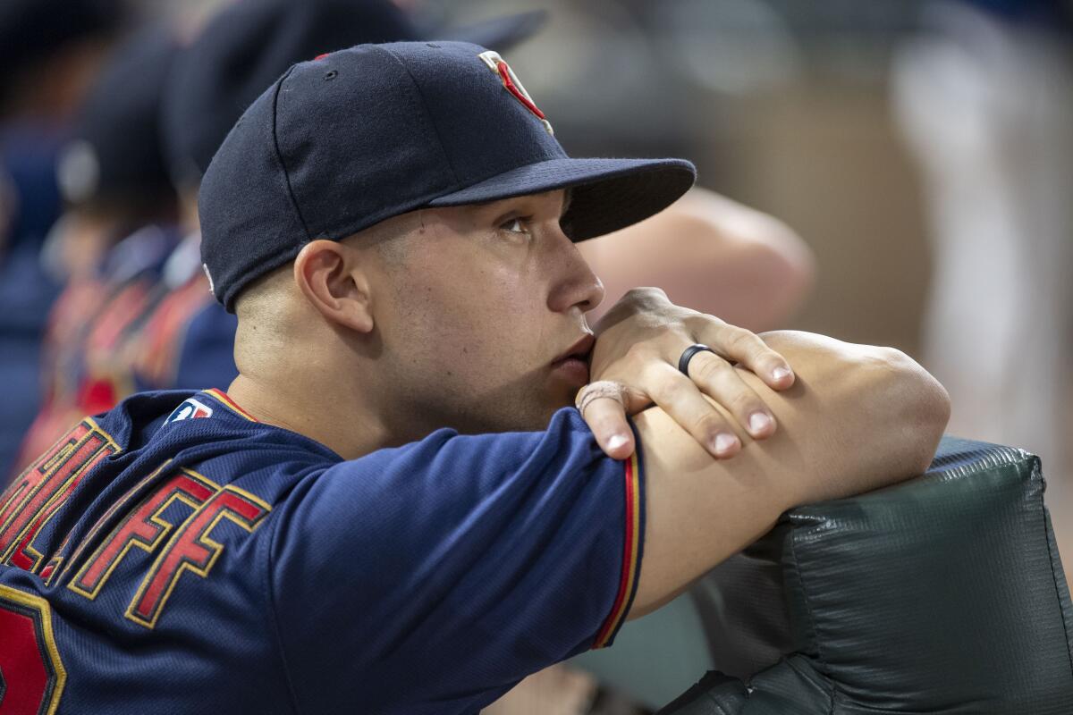 Minnesota Twins' Alex Kirilloff glances at the scoreboard during the ninth inning of the team's baseball game against the Chicago White Sox, Friday, July 15, 2022, in Minneapolis. The White Sox won 6-2. (AP Photo/Craig Lassig)
