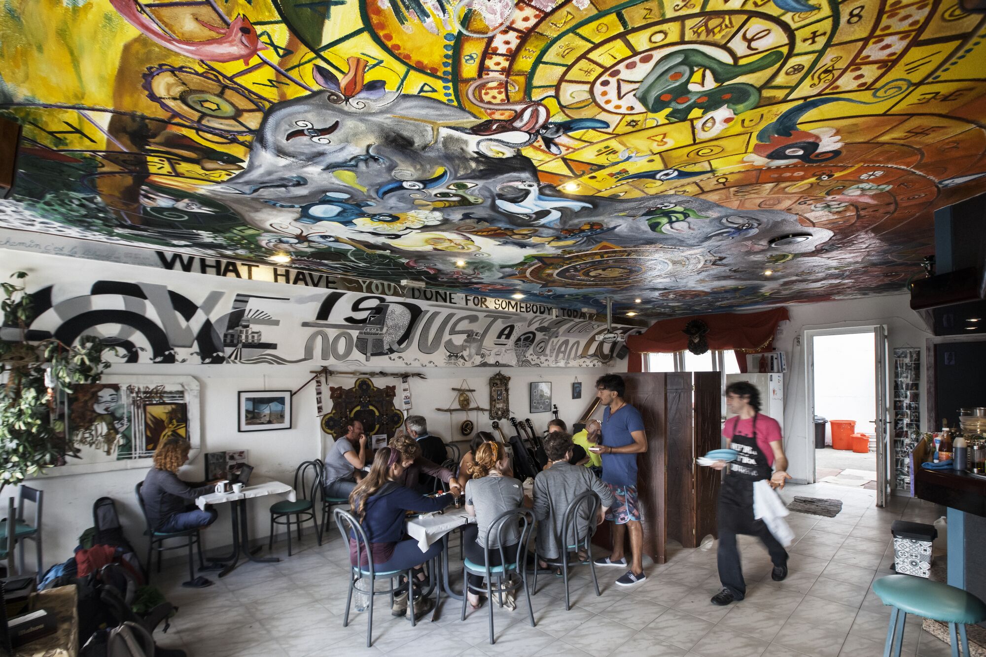 Pilgrims seated at in the World Family dining room.