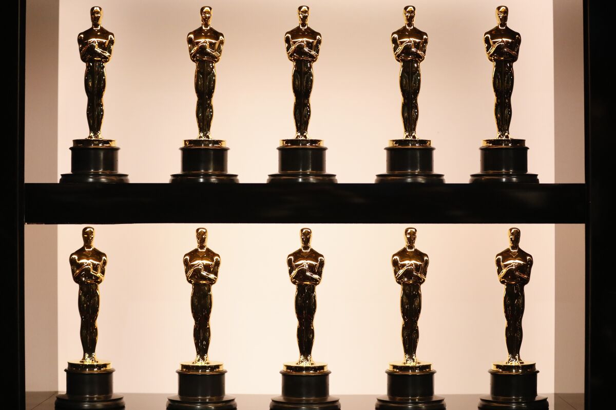 10 golden trophies lined up in two rows