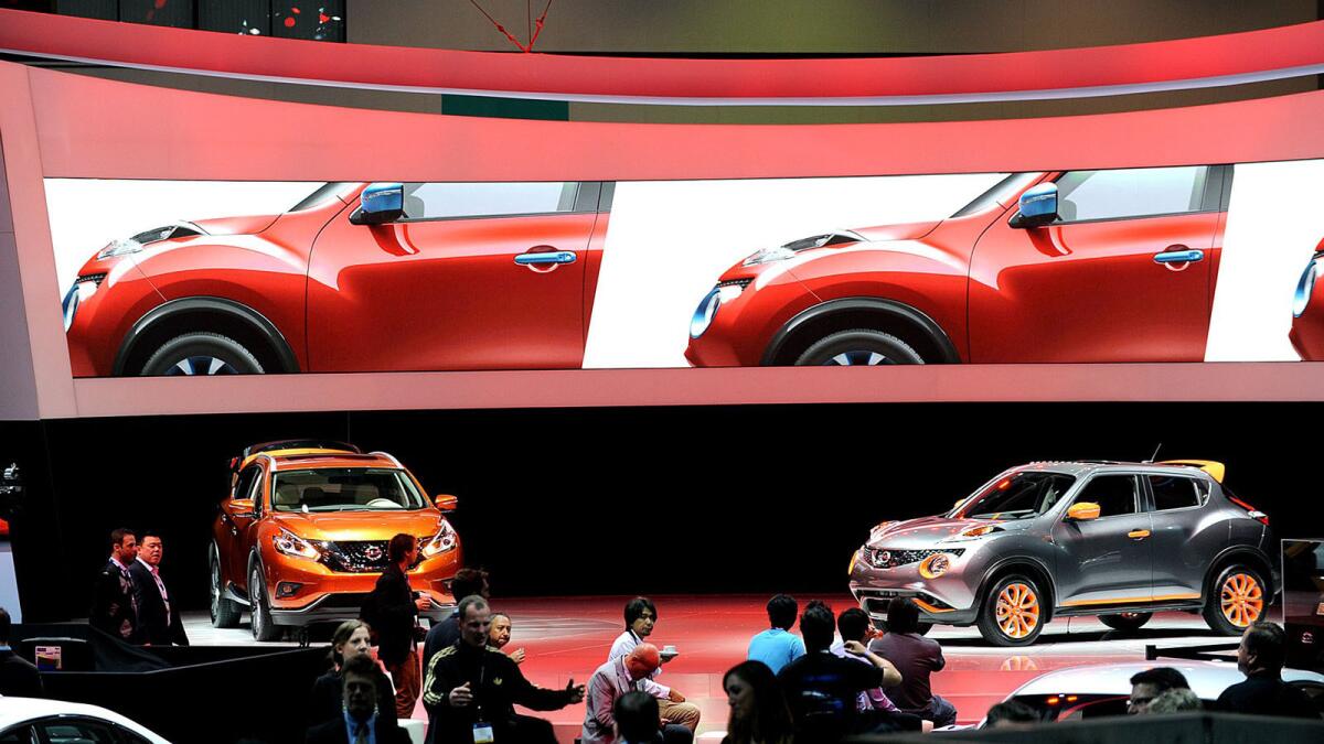 Nissan Murano, left, and Juke, right, at the 2014 Los Angeles Auto Show.