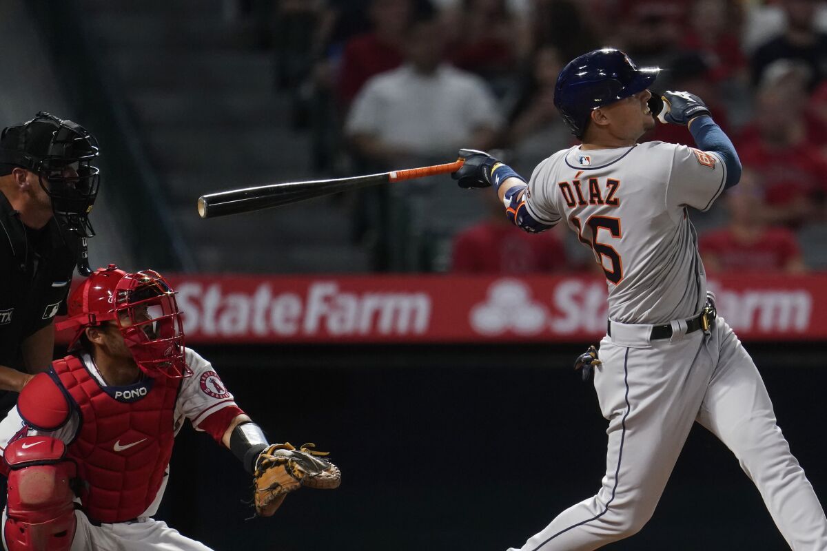 The Astros' Aledmys Diaz follows through on his solo home run during the fourth inning April 8, 2022.