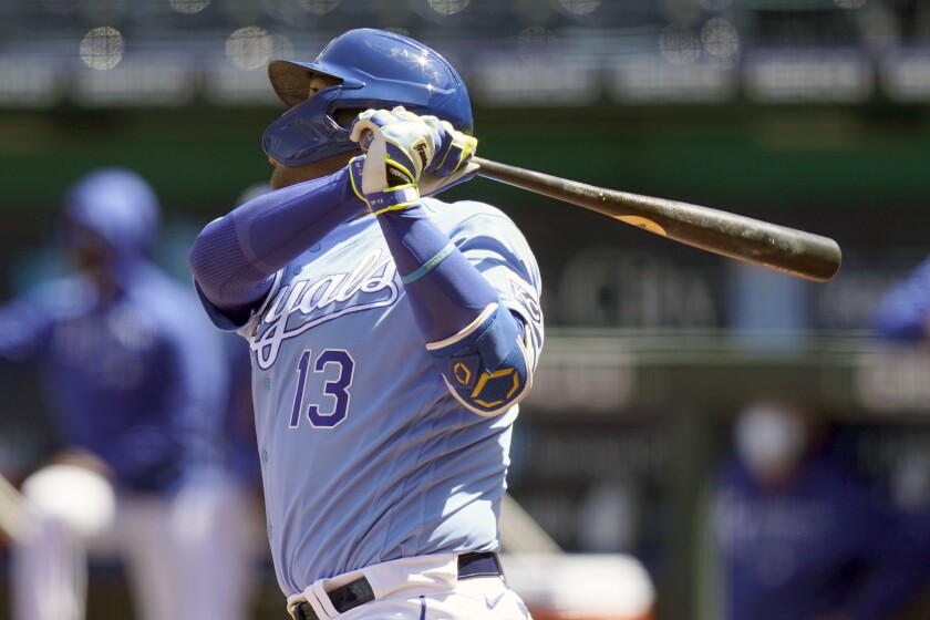 Kansas City Royals Salvador Perez hits a solo home run off Los Angeles Angels starting pitcher Griffin Canning during the third inning of a baseball game at Kauffman Stadium in Kansas City, Mo., Wednesday, April 14, 2021. (AP Photo/Orlin Wagner)