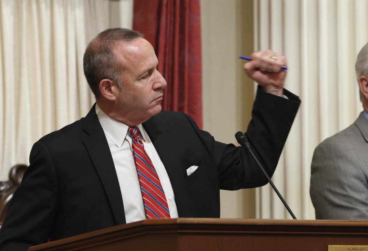 State Senate President Pro Tem Darrell Steinberg (D-Sacramento) pumps his fist in celebration after the Senate completed voting on the remaining pieces of the state budget plan in June.