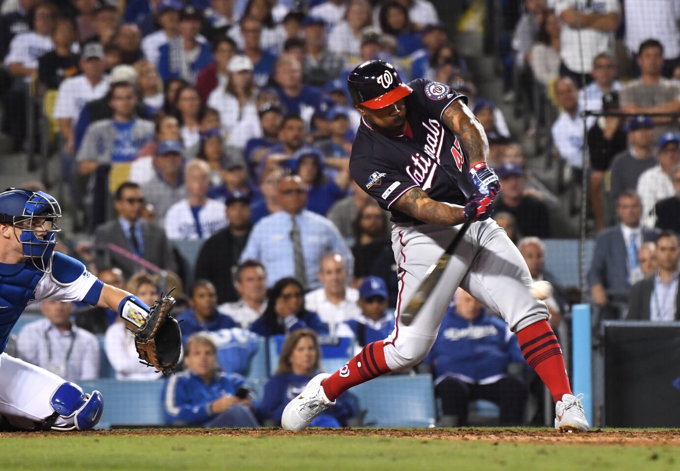 LOS ANGELES, CALIFORNIA OCTOBER 9, 2019-Nationals Howie Kendrick hits a grand slam agaisnt the Dodgers in the 10th inning in Game 5 of the NLDS at Dodger Stadium Wednesday. (Wally Skalij/Los Angeles Times)