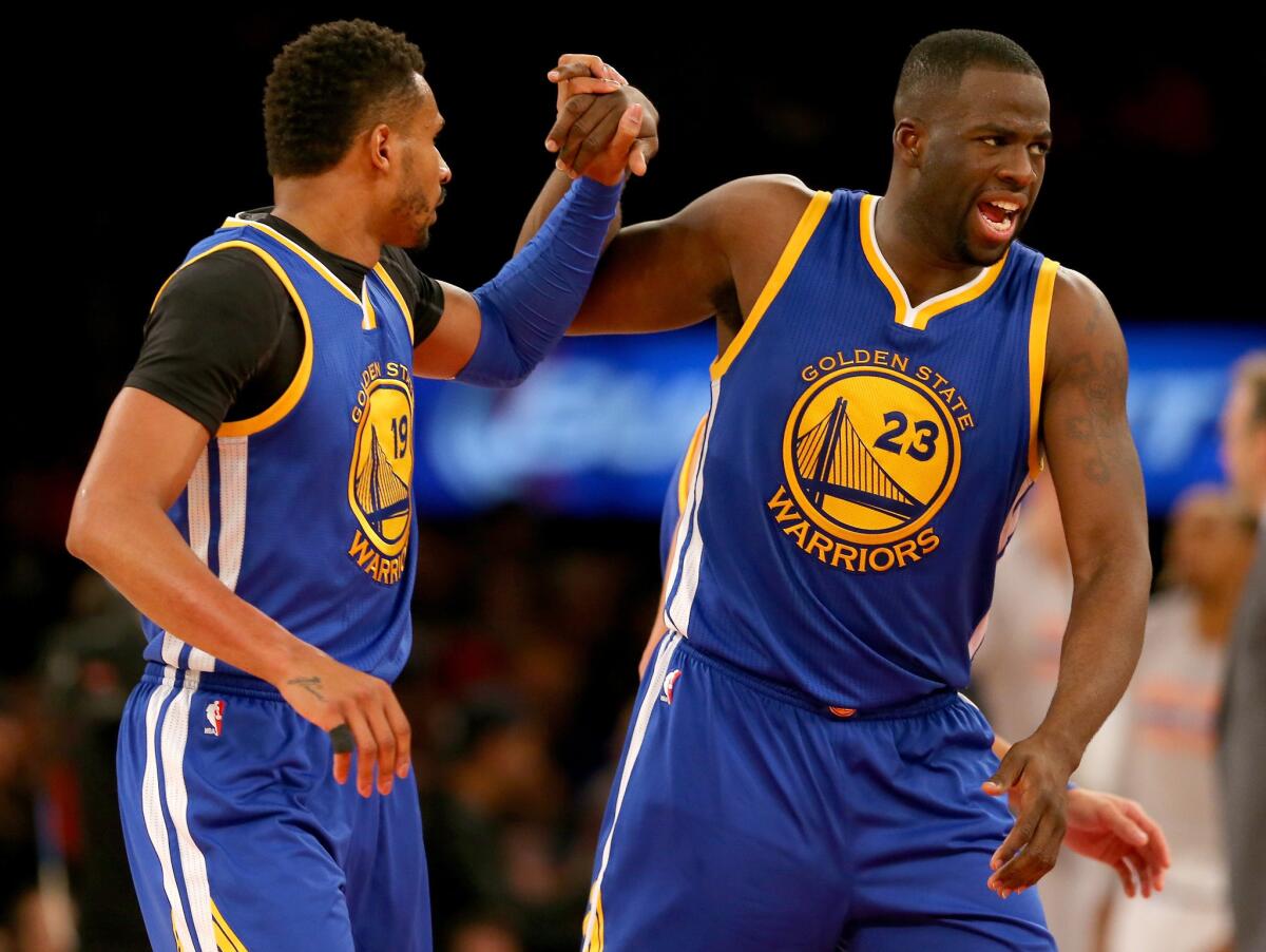 Warriors guard Leandro Barbosa and forward Draymond Green (23) celebrate in the second half of a game against the Knicks.