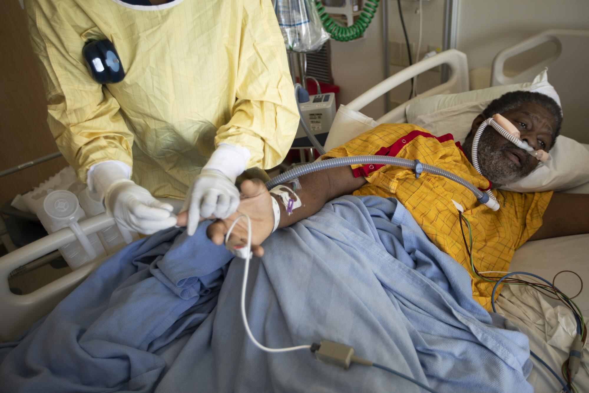 Richard Perry in his hospital bed