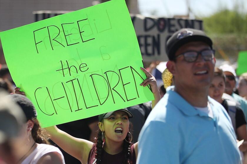 EL PASO, TX - JUNE 19: Bianey Reyes (C) and others protest the separation of children from their parents in front of the El Paso Processing Center, an immigration detention facility, at the Mexican border on June 19, 2018 in El Paso, Texas. The separations have received intense scrutiny as the Trump administration institutes a zero tolerance policy on illegal immigration. (Photo by Joe Raedle/Getty Images) ** OUTS - ELSENT, FPG, CM - OUTS * NM, PH, VA if sourced by CT, LA or MoD **