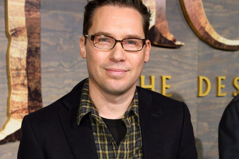 FILE - This Dec. 2, 2013 file photo shows Bryan Singer at the Los Angeles premiere of "The Hobbit: The Desolation of Smaug" at the Dolby Theatre. Singer has left the Queen biopic "Bohemian Rhapsody" in the middle of production. A representative for Twentieth Century Fox Film Corp. said Monday, Dec. 4, 2017, that Singer is no longer the director of the film. (Photo by Matt Sayles/Invision/AP, File)