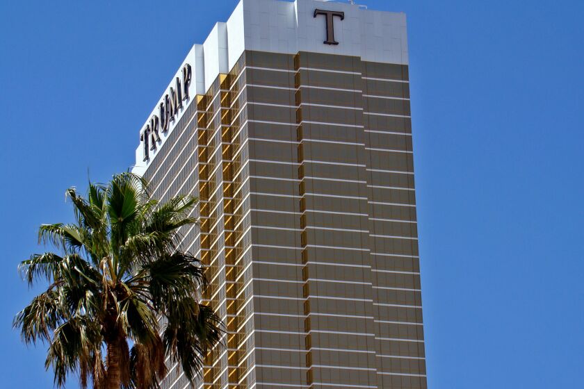 The Trump International Hotel looms over the Las Vegas Strip. Donald Trump is counting on strong voter enthusiasm to overcome Hillary Clinton's organizational edge in Nevada.