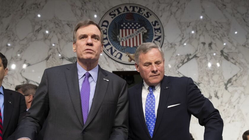 Senate Intelligence Committee leaders Mark Warner (D-Va.), left, and Richard Burr (R-N.C.) release a joint statement May 16 on the panel's conclusions in the Russia investigation.