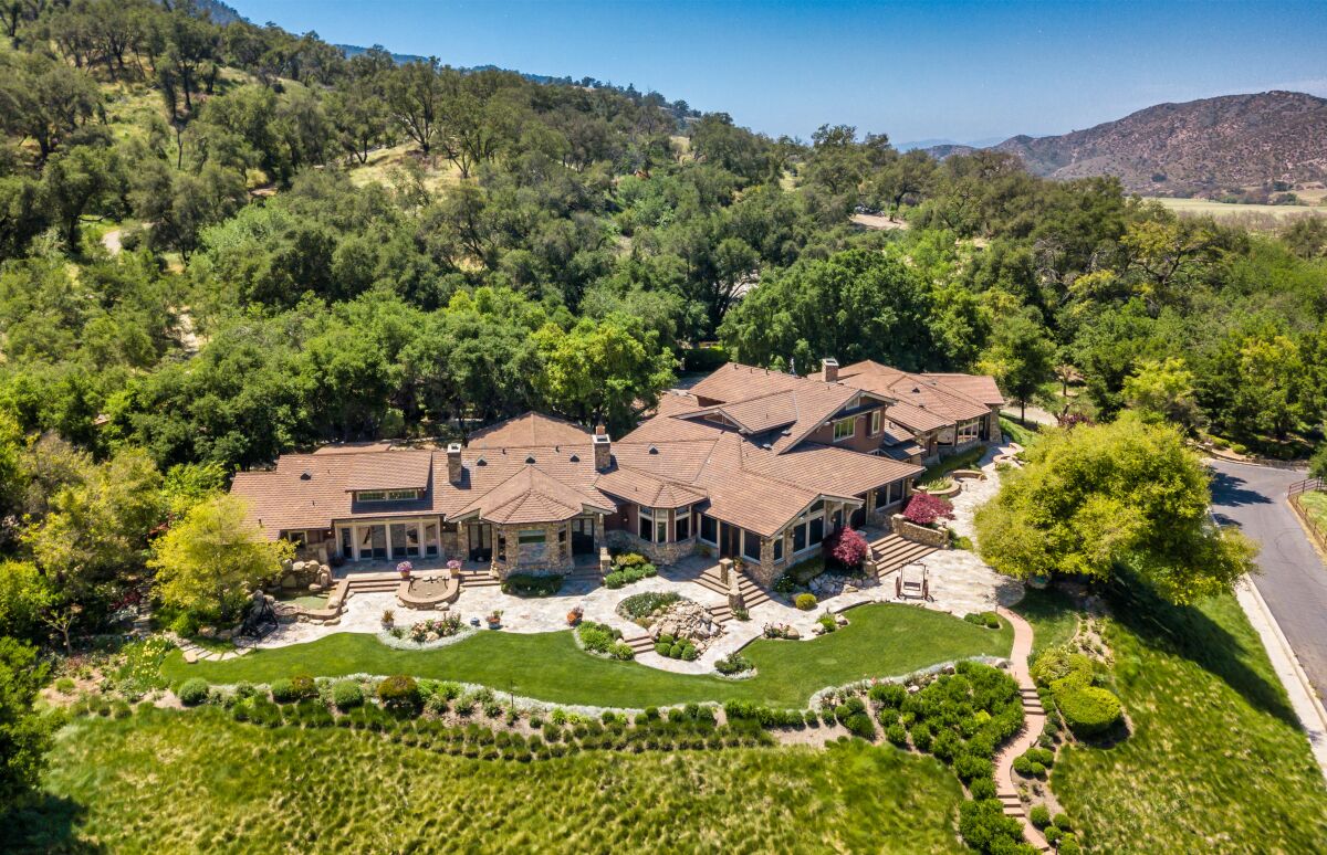 The sprawling estate combines 63 parcels and comes with a 13,000-square-foot house.