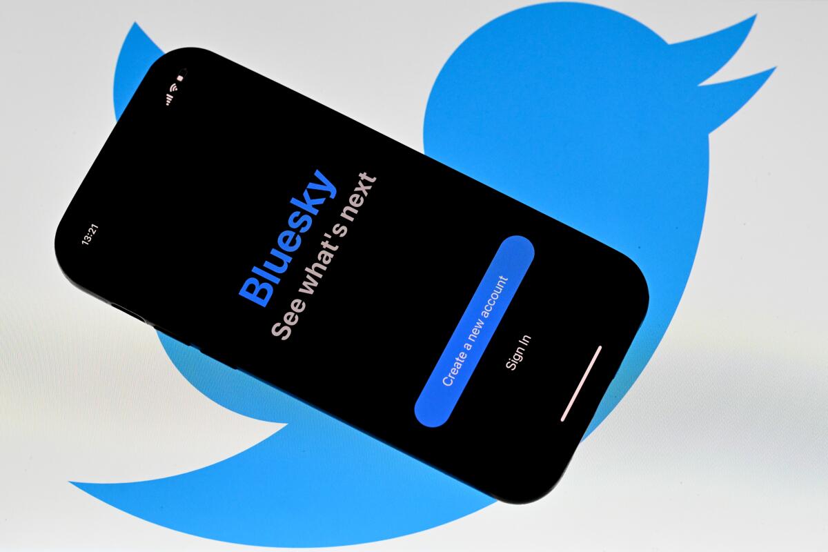 A photo illustration of Bluesky and Twitter logos