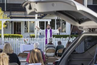 SAN PEDRO, CA - DECEMBER 13: Rev. Morgan Berg leads parishioners at the Norwegian Seaman's Church during a service in the church parking lot Sunday, Dec. 13, 2020 in San Pedro, CA. (Brian van der Brug / Los Angeles Times)