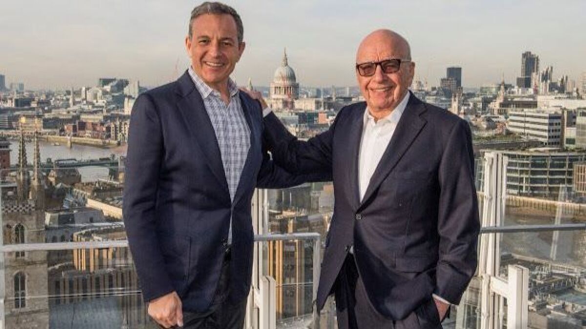 This 2017 photo of Walt Disney Chief Executive Bob Iger, left, and Rupert Murdoch foretold the future of a 2019 Disney/Fox merger.