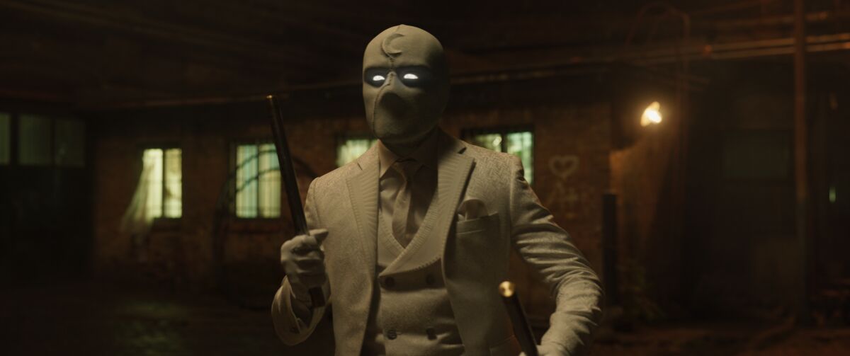 A masked man in an all-white suit.