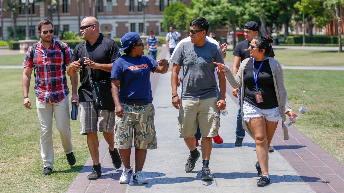Military veterans enrolled in the Warrior Scholar Project at USC walk across campus July 28.