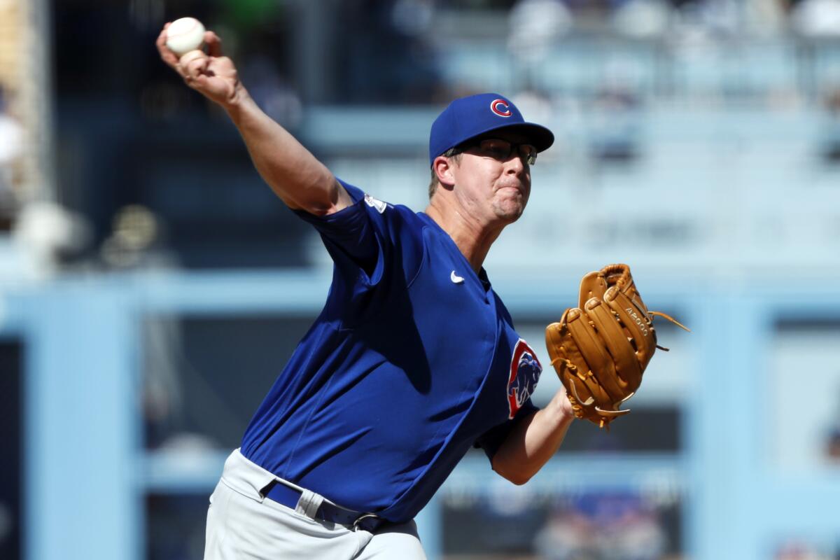 Chicago Cubs starting pitcher Alec Mills throws during the first inning Saturday.