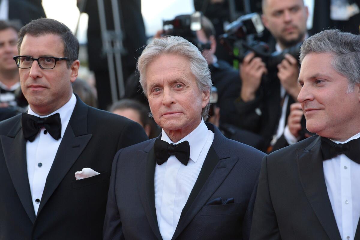 "Behind the Candelabra" screenwriter Richard LaGravenese, left, actor Michael Douglas and book writer Scott Thorson at the film's screening in Cannes.