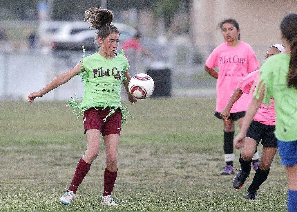 - Newport Coast's Sophia Harvey tracks down the ball during a Pilot Cup girls' 5-6 silver division game against Whittier on Thursday.