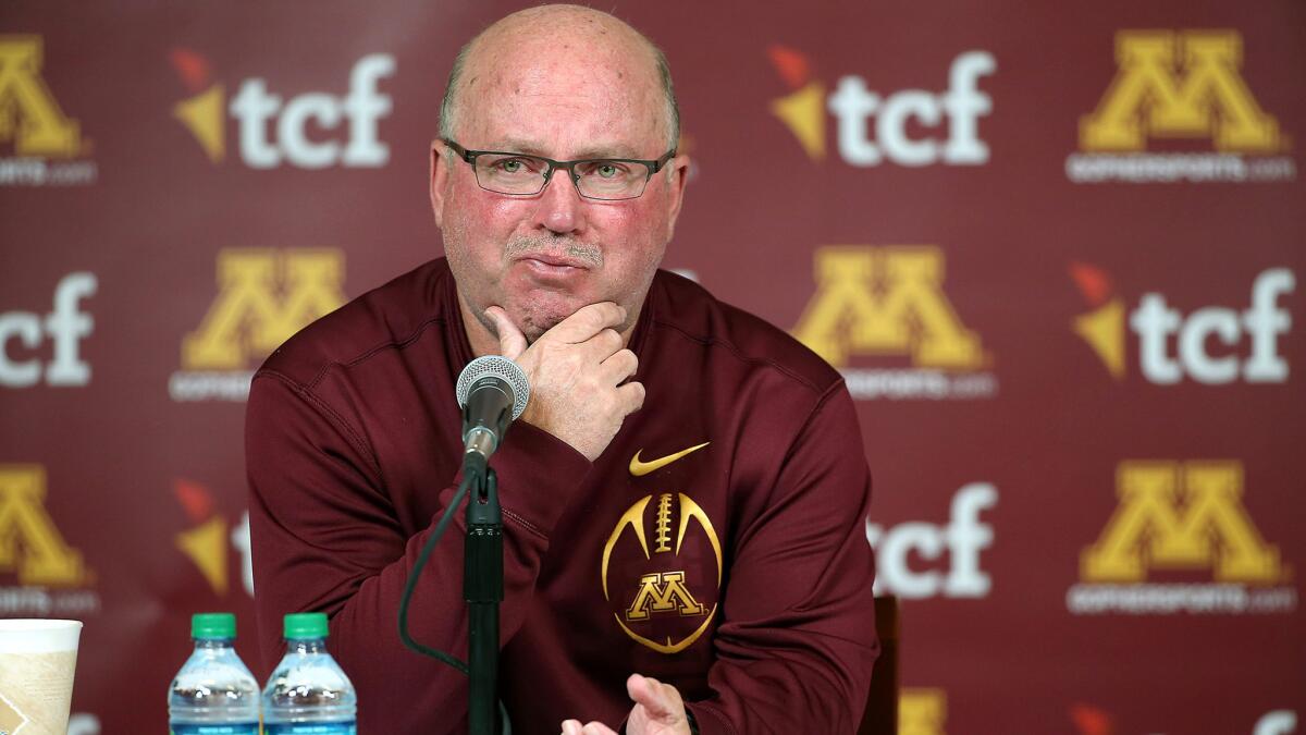 Jerry Kill becomes emotional as he speaks about his retirement during a news conference Wednesday.