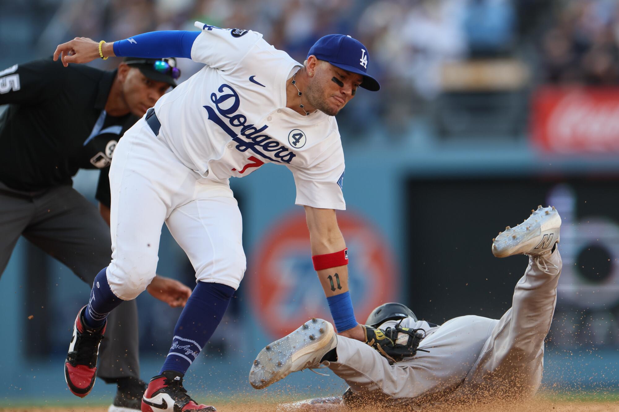 Dodgers shortstop Miguel Rojas tags out New York Yankees catcher Austin Wells.