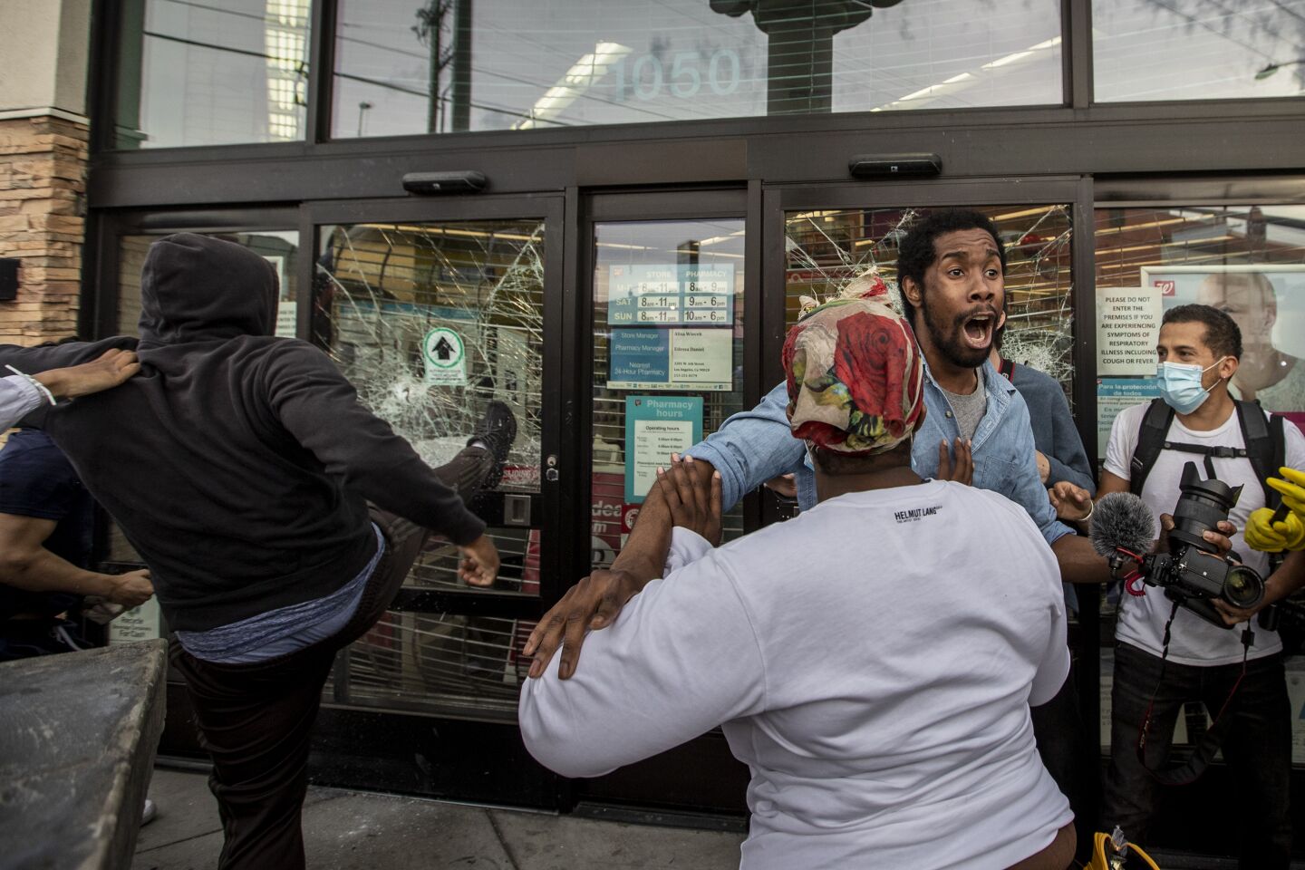 AJ Lovelace, director and writer, tries to stop looters from breaking into a Walgreens.