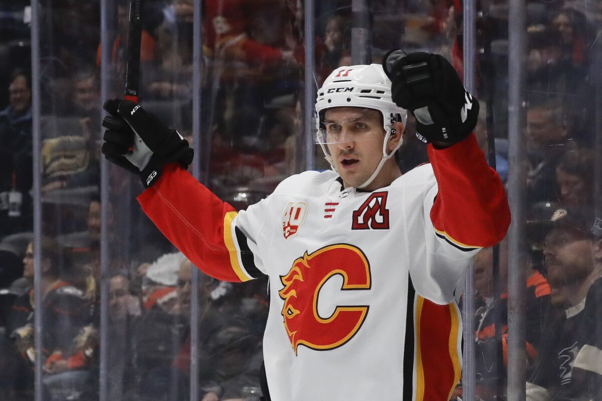 Calgary Flames center Mikael Backlund celebrates after scoring against the Anaheim Ducks during the first period of an NHL hockey game in Anaheim, Calif., Thursday, Feb. 13, 2020. (AP Photo/Chris Carlson)